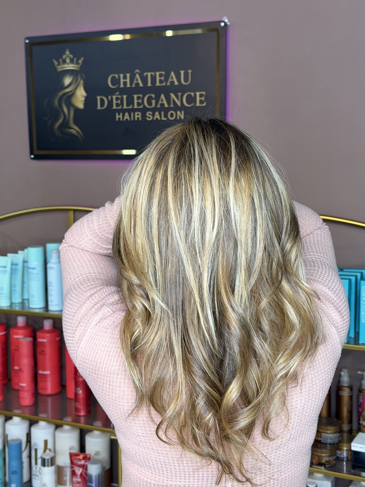 Balayage result in front of the Chateau D'Elegance studio sign