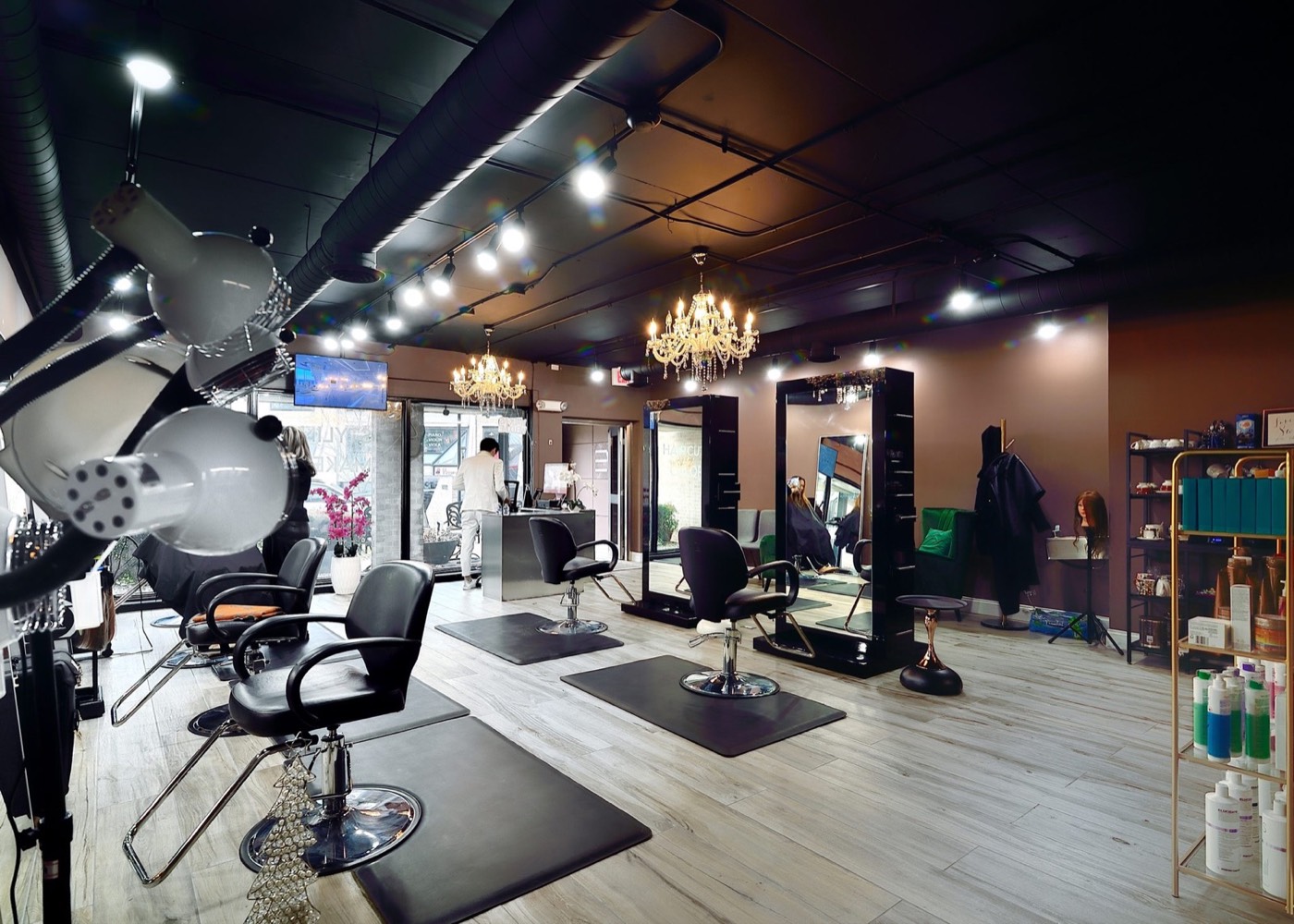 Styling stations and chandeliers inside Chateau D'Elegance Hair Salon